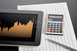 11849494-modern-stock-market-analyze-with-digital-tablet-calculator-pen-and-printed-data-sheet[1]